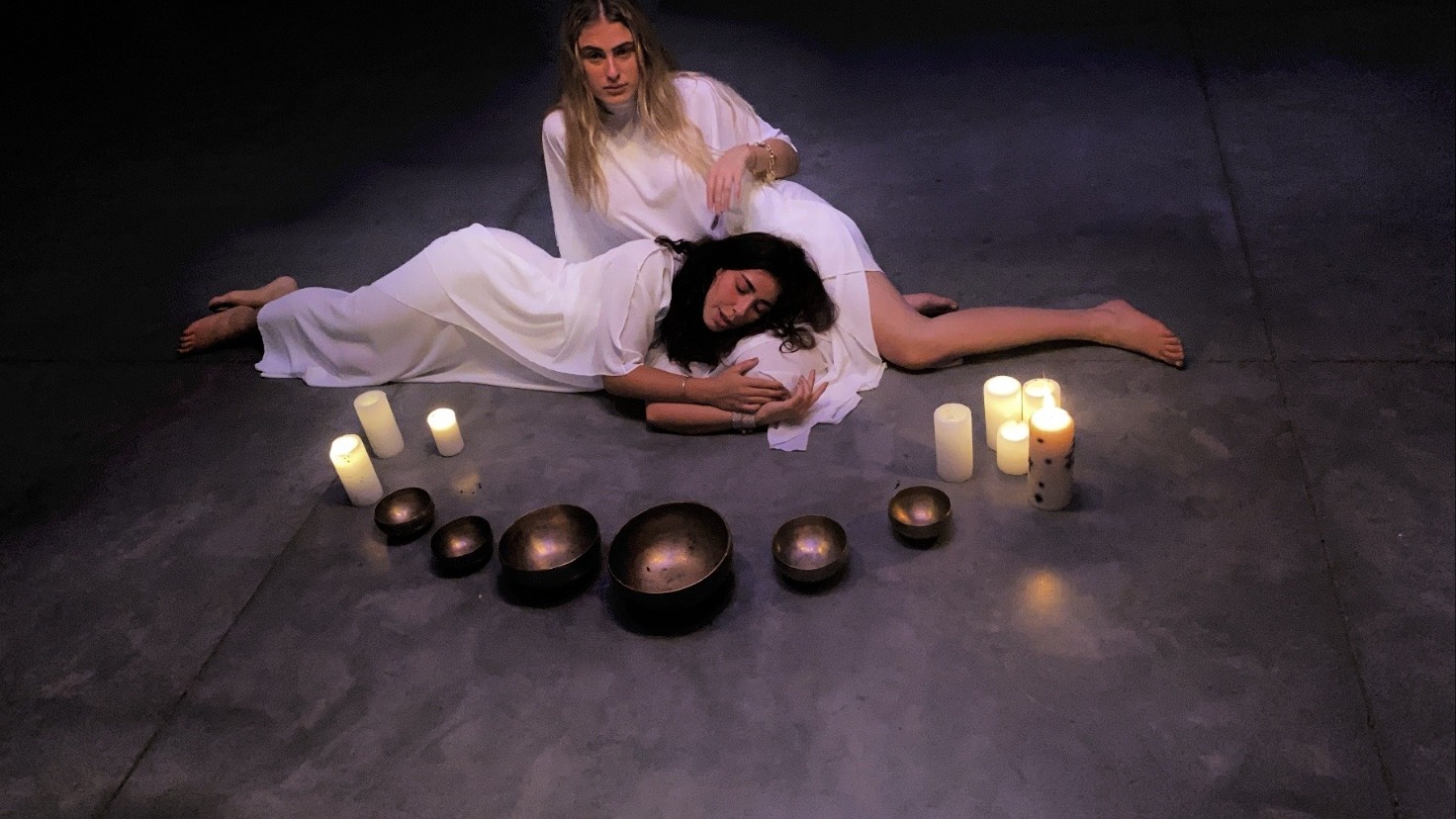 Bowls and candles arranged on the floor.