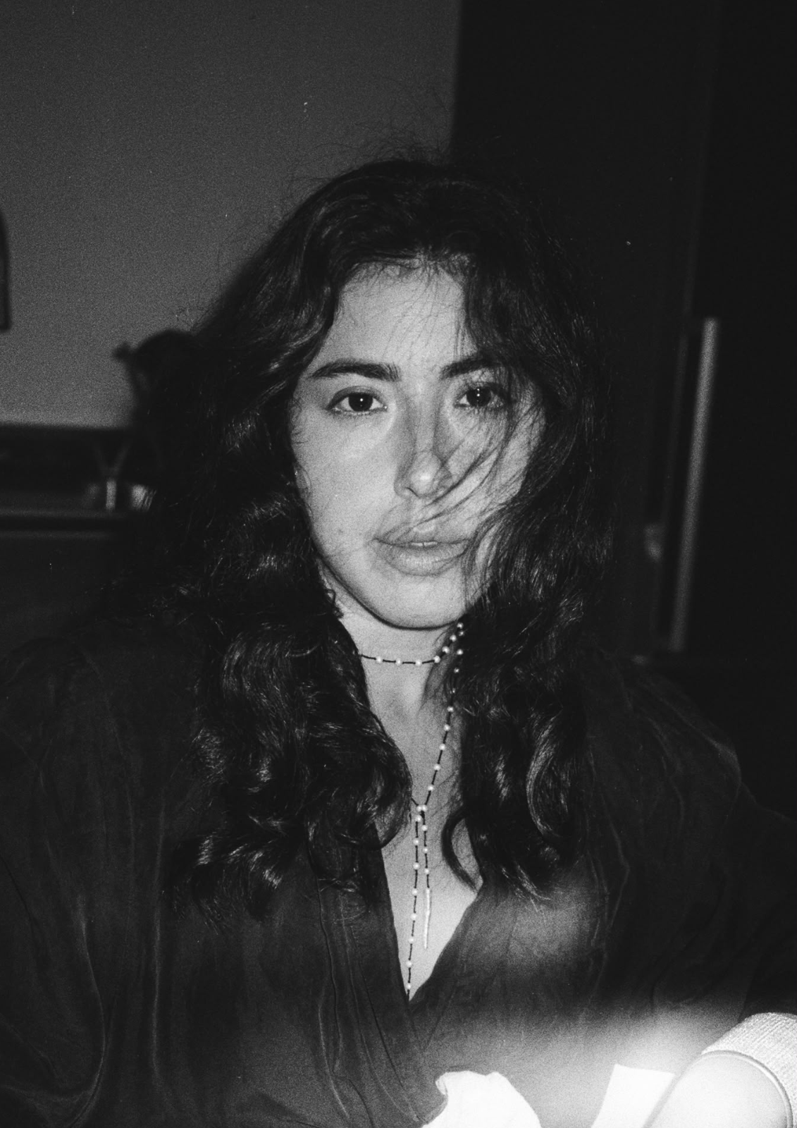 Portrait of Goni Itay in soft natural light, black and white film.